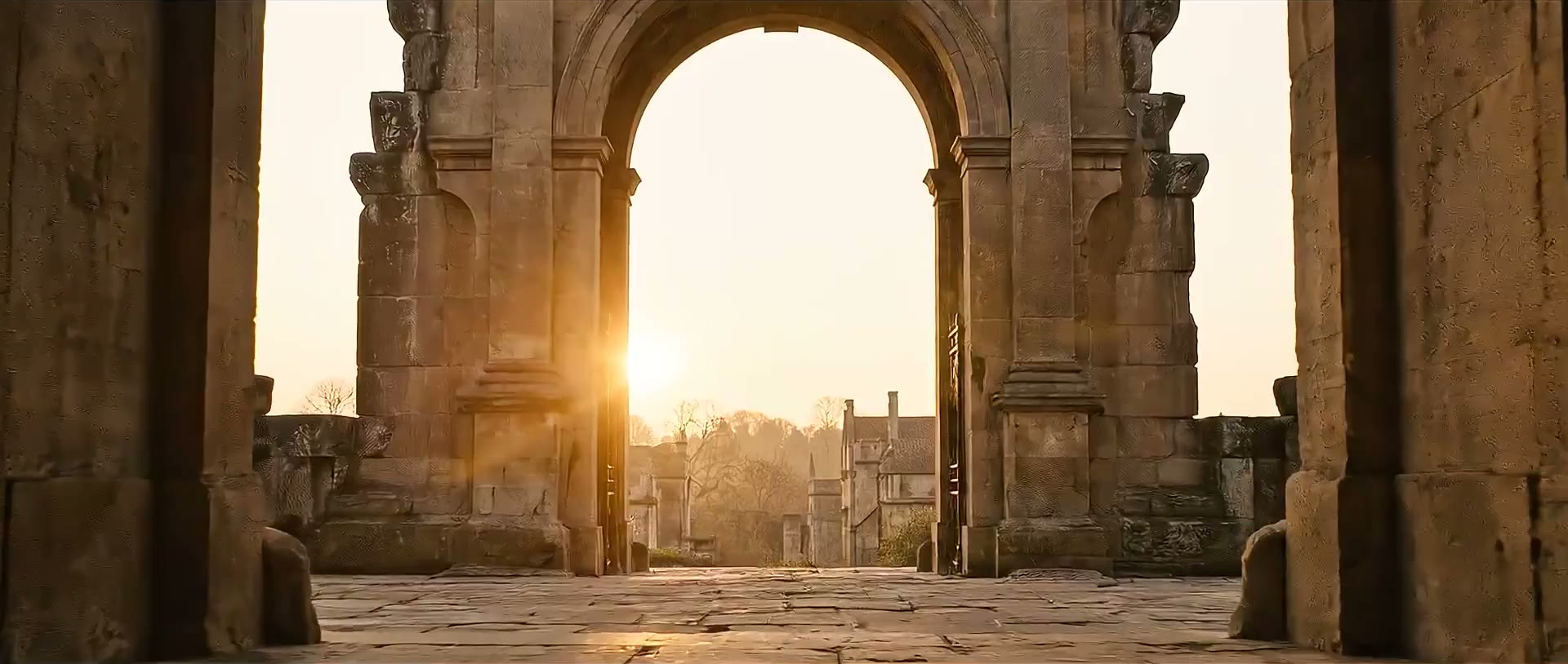 A stone archway opening toward warm light beyond.